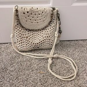 The Sak handwoven crochet Lucia crossbody with flap closure.  Perfect condition.